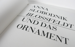 An open book with its title page. 