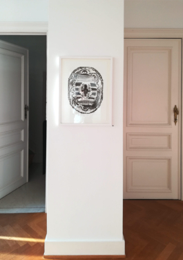 A view of two doors, in the middle of them a framed lithograph of a carpet. Anna Slobodnik, 2018. 