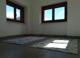 A room with two windows, on the floor two assembled paintings of tiles on paper. Anna Slobodnik, 2018. 