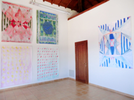 On the left four large paintings on paper, on all of them different patterns in red, yellow, blue and green. On the left one painting on paper with stripes and triangles in blue, orange and red. Anna Slobodnik, 2018., 