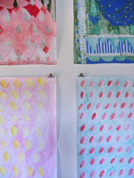 Detail of the corners of four paintings on paper with different patterns in red, green, pink, yellow and blue. Anna Slobodnik, 2018. 