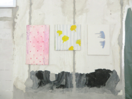 Three paintings. From left to right: A pink painting with dots on it, a square painting with yellow flowers on light blue stripes, one white painting with two blue dripping forms. Anna Slobodnik 2015. 