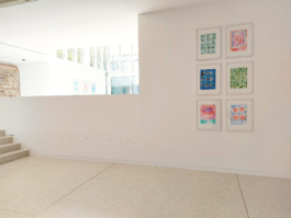 Exhibiton view of six small drawinggs in the foreground and three stoneprints in the background 