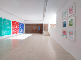 Exhibition view with three big tilepaintings to the left and six small drawings of patterns on the right. 