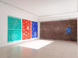 Exhibition view of three big tile paintings and one smaller painting in blue. 