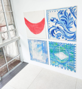 Exhibtion view of four big canvas paintings in red blue and green. 