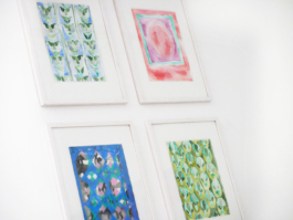 Close up of framed drawings of ornaments and patterns. 