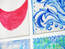 Close up of the corners of four big canvas paintings. 