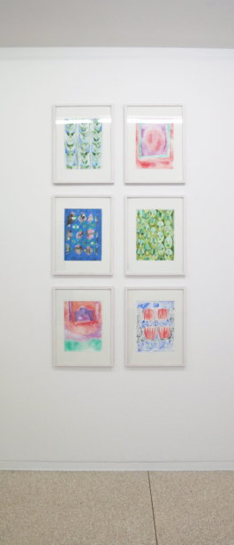 Six framed drawings in red blue and green. 