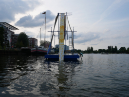 A raft with a yellow picture hanging down on it. 