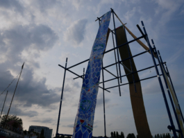 A blue ornament in front of the blue sky. 