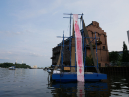 A long red painting on a raft. 
