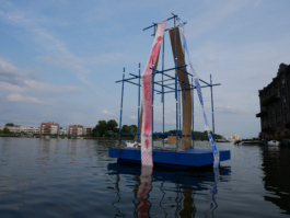 A red and blue ornamental painting on a raft. 