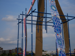 A close up of a blue and a red painting with ornaments on the raft. 