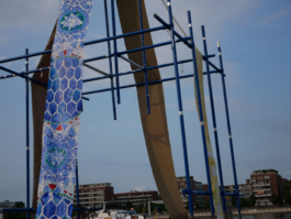 A detail of a blue ornament on a painting on a raft. 
