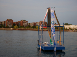 A raft with a blue and a red painting on it. 