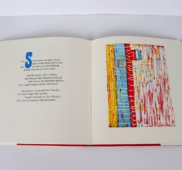 An open book, to the left a poem, to the right a woodcut.