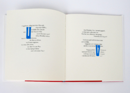 An open book with two poems on each side one.
