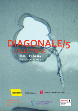 A blue stone wall with a hole in it and the title of the exhibition on top of it.