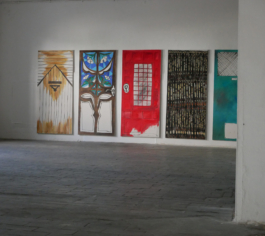 Exhibition view of Anna Slobodniks paintings of five doors. 