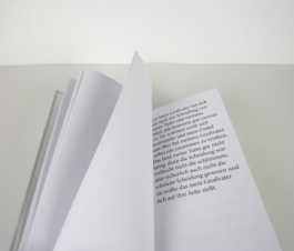 An open book with a text on the right page.