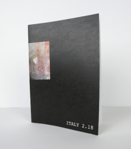 A black book standing. 