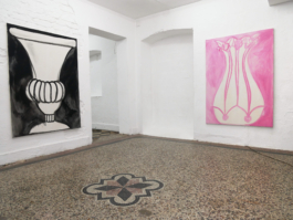 One black and white painting of a vase to the left and one of a vase with roses in pink to the right. 