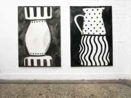 Two paintings in black and white, the left one with a vase on it, the right one with a jug. 