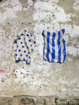 Two ceramic works of pendant kitchen towels, one with dots the other one with stripes. 