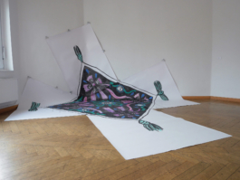 A painting of a quadratic scarf in ink, purple and turquoise on five pieces of paper. 