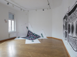 Exhibition view of the exhibition What are we made of with two large scale paintings of a scarf and a bracelet and a small ceramic. 